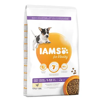 Saco de pienso IAMS for Vitality Puppy con pollo fresco, 12 kg, para cachorros de 1–12 meses. Imagen de croquetas y perro pequeño en el envase. Texto visible en varios idiomas.