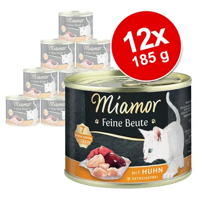 Miamor Feine Beute kattemad, 12 x 185 g dåser. Synlig tekst: 7 Sieben Sorten Fleisch & Innereien, mit Huhn, getreidefrei. Billede af hvid kat og kød på dåsen.