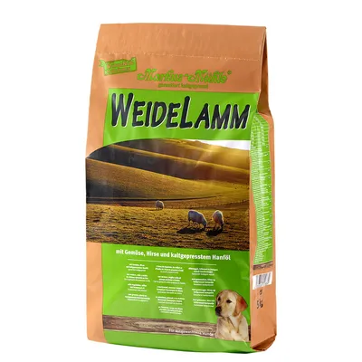 Markus-Mühle Weidelamm krmivo pro psy s zeleninou, prosem a za studena lisovaným konopným olejem. Pro dospělé psy. Balení zobrazuje pastvinu s ovcemi.