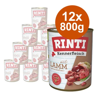 Lot de 12 boîtes RINTI Kennerfleisch mit Lamm, 800 g chacune, texte visible : getreidefrei, image de viande et abats sur l’emballage. Lot de 12 boîtes RINTI Kennerfleisch mit Lamm, 800 g chacune, texte visible : getreidefrei, image de viande et abats sur l’emballage.