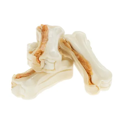 Trois os à mâcher blancs en forme d’os, garnis d’une bande centrale beige, sans marque visible ni emballage.