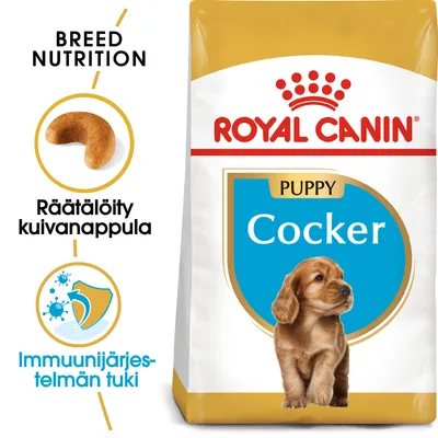 Royal Canin Puppy Cocker -koiranruokapakkaus, tekstit: räätälöity kuivanappula, immuunijärjestelmän tuki. Näkyvissä myös nappulan kuva ja koiranpentu.