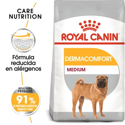 Saco de pienso Royal Canin Dermacomfort Medium. Texto visible: 'Fórmula reducida en alérgenos', '91% de propietarios satisfechos después de 2 meses'. Imagen de perro mediano.