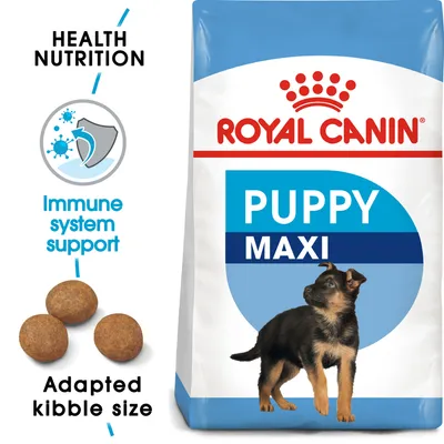 Royal Canin Puppy Maxi -koiranruokapakkaus, tekstit: Health Nutrition, Immune system support, Adapted kibble size. Kuvassa nappuloita ja pentukoira. Royal Canin Puppy Maxi -koiranruokapakkaus, tekstit: Health Nutrition, Immune system support, Adapted kibble size. Kuvassa nappuloita ja pentukoira.