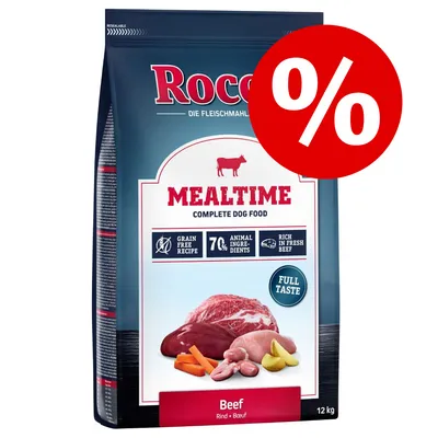 Сухой корм для собак Rocco MEALTIME Beef, 12 кг. Надпись: Grain free recipe, 70% animal ingredients, rich in fresh beef, full taste. Изображены мясо, овощи. Значок процента скидки.