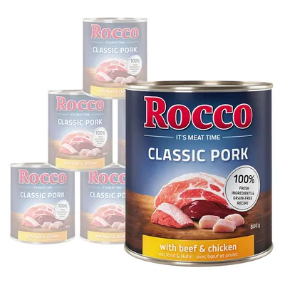 Rocco Classic Pork dåsefoder, 800 g. Synligt: 'with beef & chicken', '100% fresh ingredients & grain-free recipe', billede af kød på etiketten. Pakke med fem dåser.