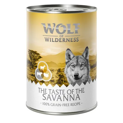 Wolf of Wilderness The Taste of the Savanna, 100% grain-free recipe, dåse med savannemotiv og dyresilhuetter på etiketten.