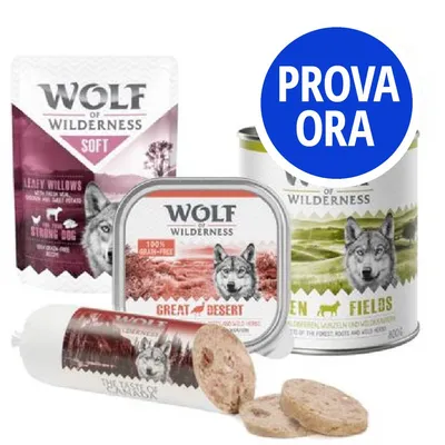 Prodotti Wolf of Wilderness per cani: bustina Soft, vaschetta Great Desert, lattina Green Fields, salsiccia affettata. Cerchio blu con testo 'PROVA ORA'.