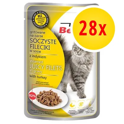 Confezione di filetti succosi in salsa con tacchino per gatti, testo visibile in polacco e inglese, immagine di un gatto grigio e piatto di filetti, etichetta gialla con '28x' in rosso.