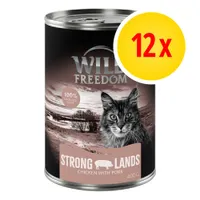 12x Wild Freedom Strong Lands Chicken with Pork, 400 g, 100% grain free, immagine di un gatto sulla confezione
