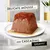 Delicate mousse and cascading gravy, shown as text on image of pet food block with gravy on white plate.