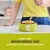 A person puts food into a green bowl with a paw print and the letter A. Text: Feed their adventurous side with our tasty range of recipes.