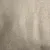 Nærbillede af beige tekstil med synlig vævet struktur, materiale sandsynligvis stof. Ingen synlige mærker eller tekst.