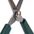 Close-up of scissors with green handles and adjustable metal screw.