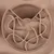 Round feeding maze made of beige plastic with cat head design and winding tracks for slow feeding.
