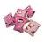 Rosa Kissen mit Hello Kitty-Motiven, verschiedene Designs und Muster.