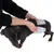 Demonstration of the use of dog nappies with a grey zigzag pattern on a small dog.