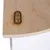 Tiaki logo on a wooden surface, visible in a product detail image.