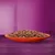 Chunks of wet pet food in gravy served on an orange plate, shown against a purple background.