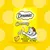 Dreamies Creamy with delicious cheese, 4 x 10g sachets shown on yellow packaging with cartoon cat and cheese illustration.