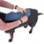 Person fastening a closure on a black and blue dog coat. Shows correct use of the coat.