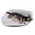 Dog lying on a grey dog bed with soft padding and brown brand label from Modern Living.