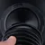 Black, stackable feeding bowl made of plastic with removable insert, close-up.
