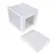White cube box with perforated sides and removable cushion, suitable as a sleeping place or hideaway. Box made of wood, cushion with fabric cover.