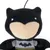 Black plush toy shaped like a superhero with a bat symbol on the chest.