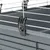 Close-up of a black clip securing the grid cover to a grey plastic tray.