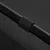 Close-up of a black metal tube with a ribbed plastic ring, part of a product or accessory.