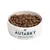 Bowl filled with brown kibble, labelled 'Autarky Complete Dog Food'.