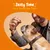 Person holding a treat above a dog’s head with visible text: 'Zesty Time is a Treat for'. Demonstrates giving a treat to a dog.
