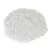 Round, white faux fur mat with a fluffy surface.