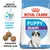 Royal Canin Puppy Giant -koiranruokapakkaus, tekstit: Health Nutrition, Immune system support, Adapted kibble size. Kuvassa myös nappuloita ja pentukoira. Royal Canin Puppy Giant -koiranruokapakkaus, tekstit: Health Nutrition, Immune system support, Adapted kibble size. Kuvassa myös nappuloita ja pentukoira.