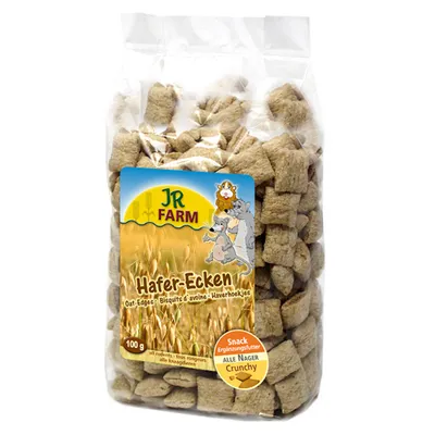 Biscuits d’avoine JR Farm Hafer-Ecken, sachet de 100 g, texte visible : Snack Crunchy pour tous rongeurs, Biscuits d’avoine, Oat-Egges, Ergänzungsfutter, ALLE NAGER.