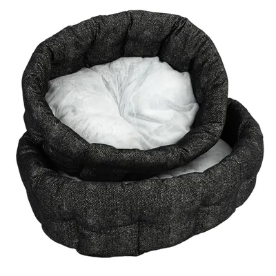 Letto per animali nero, rotondo, con bordo imbottito e superficie interna bianca e morbida. Due letti identici impilati uno dentro l'altro.