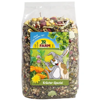 JR Farm Kräuter-Spezial, μείγμα βοτάνων και λαχανικών, συσκευασία με εικονογράφηση κουνελιού και ινδικού χοιριδίου. Κείμενο: Φρέσκο από τη φάρμα μας.