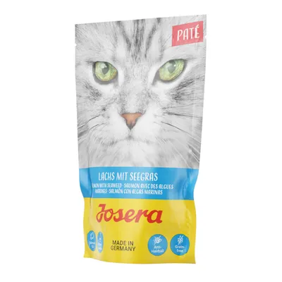 Josera Paté losos s mořskou řasou, vyrobeno v Německu, proti bezoárům, bez obilovin. Na obalu je kočka se zelenýma očima.