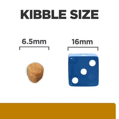 Kibble size comparison showing a 6.5mm kibble next to a 16mm blue dice for scale.