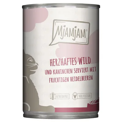 MjAMjAM Herzhafte Wild und Kaninchen serviert mit fruchtigen Heidelbeeren -kissanruokapurkki, saksankielinen teksti, kuvassa myös viljaton- ja paljon lihaa -symbolit.