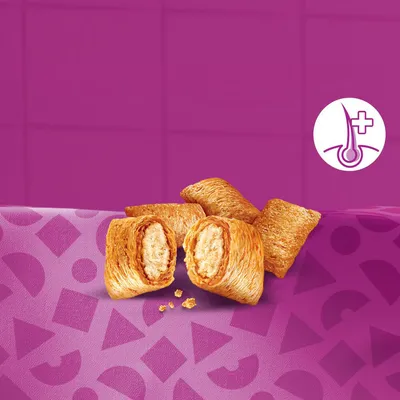 Gevulde krokante snacks, opengebroken om vulling te tonen, op paarse achtergrond met symbool van haar en plus-teken zichtbaar rechtsboven.