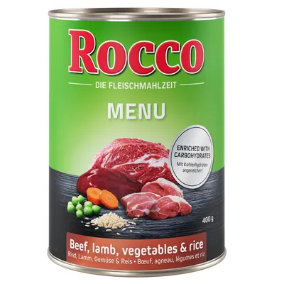 Lata de 400 g Rocco Menu, com texto visível: 'Beef, lamb, vegetables & rice', 'ENRICHED WITH CARBOHYDRATES'. Imagem de carne de vaca, borrego, ervilhas, cenoura e arroz.