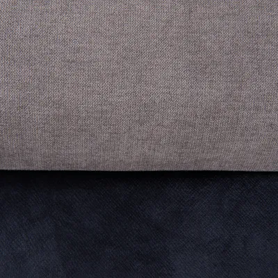 Close-up van twee stofsoorten: boven grijze textielstof, onder zwarte velours.