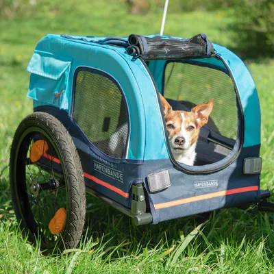 Hafenbande Fahrradanhänger in Blau mit Netzfenstern, zwei grossen Rädern und Reflektoren. Geeignet für den Transport von Haustieren.