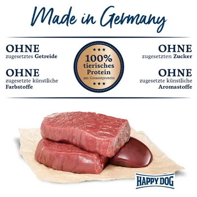 Made in Germany. 100% tierisches Protein am Gesamtprotein. Ohne zugesetztes Getreide, Zucker, künstliche Farbstoffe und Aromastoffe. Happy Dog Logo sichtbar.