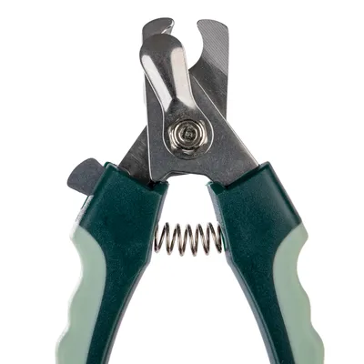 Nail clippers with green handle and metal blades, suitable for precise cutting of animal nails. Spring mechanism visible.