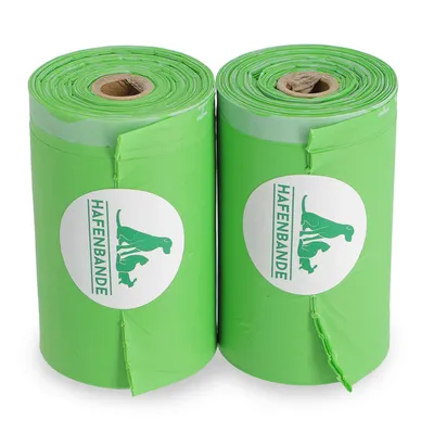 Zwei grüne Rollen mit Hafenbande-Logo, vermutlich Hundekotbeutel.