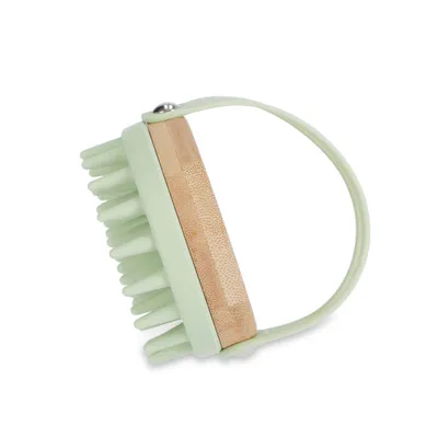Hand brush with green silicone head and bamboo handle, suitable for coat care. With adjustable strap for better grip.