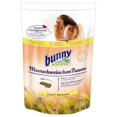 Ambalaj hrană pentru rozătoare Bunny Nature MeerschweinchenTraum BASIC, imagine cu un cobai și text în germană despre ingrediente și vitamina C. Pentru vârsta de la 5 luni.